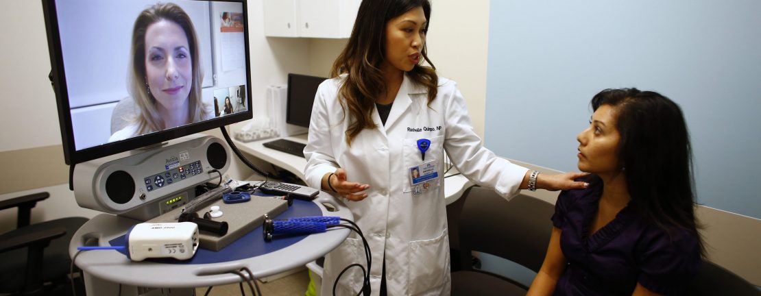 Nurse Health Practitioner Rachelle Quimpo (C) introduces patient Shreya Sasaki to Dr. Heidi Meyer, MD Family Medicine, who appears on a video screen remotely at a newly opened Kaiser Permanente health clinic inside a Target retail department store in San Diego, California November 17, 2014. Four clinics are scheduled to open in Southern California to provide pediatric and adolescent care, well-woman care, family planning, and management of chronic conditions like diabetes and high blood pressure for Kaiser members and non-members.

     REUTERS/Mike Blake (UNITED STATES - Tags: HEALTH BUSINESS SOCIETY)