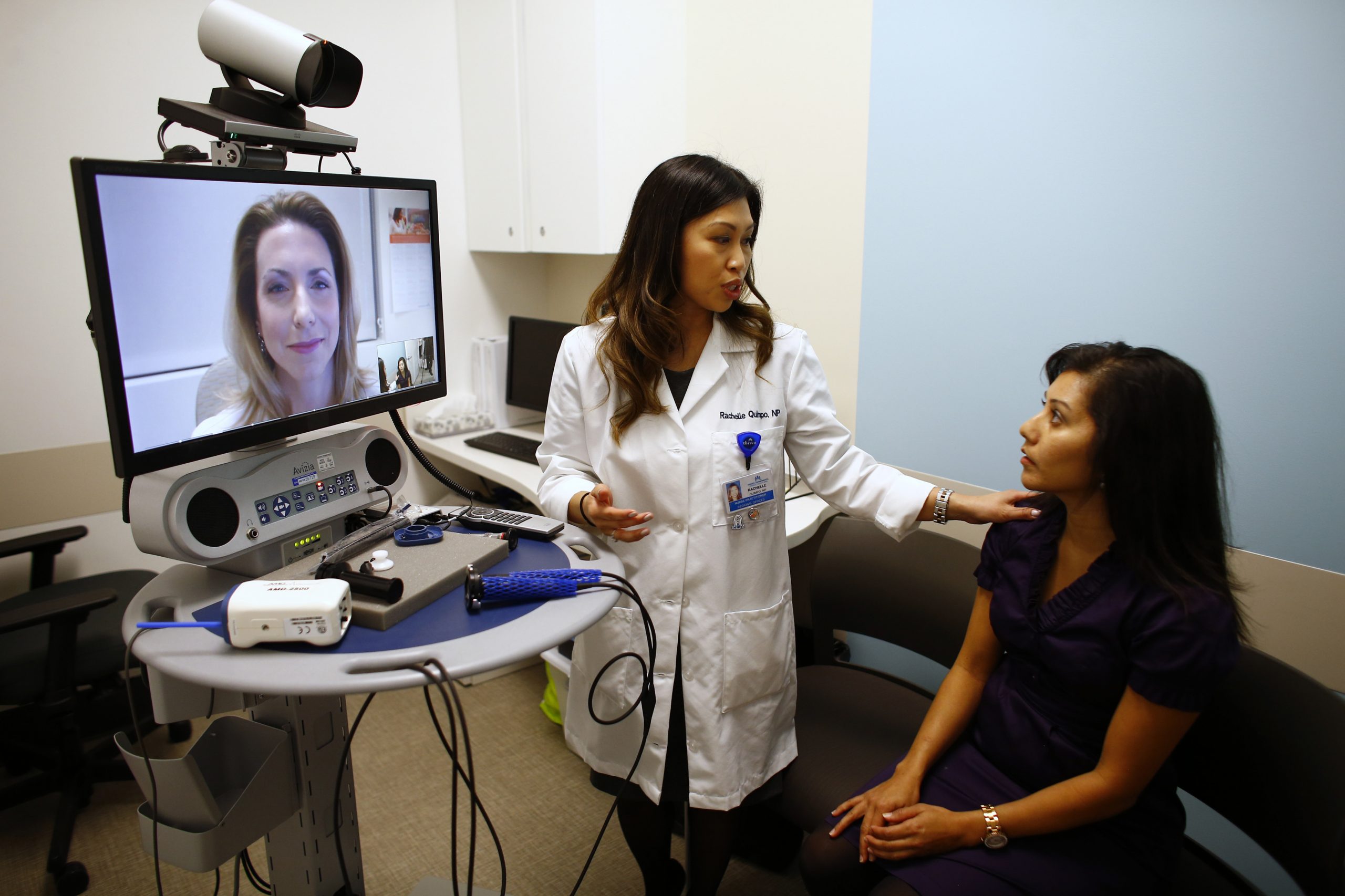 Nurse Health Practitioner Rachelle Quimpo (C) introduces patient Shreya Sasaki to Dr. Heidi Meyer, MD Family Medicine, who appears on a video screen remotely at a newly opened Kaiser Permanente health clinic inside a Target retail department store in San Diego, California November 17, 2014. Four clinics are scheduled to open in Southern California to provide pediatric and adolescent care, well-woman care, family planning, and management of chronic conditions like diabetes and high blood pressure for Kaiser members and non-members.

     REUTERS/Mike Blake (UNITED STATES - Tags: HEALTH BUSINESS SOCIETY)